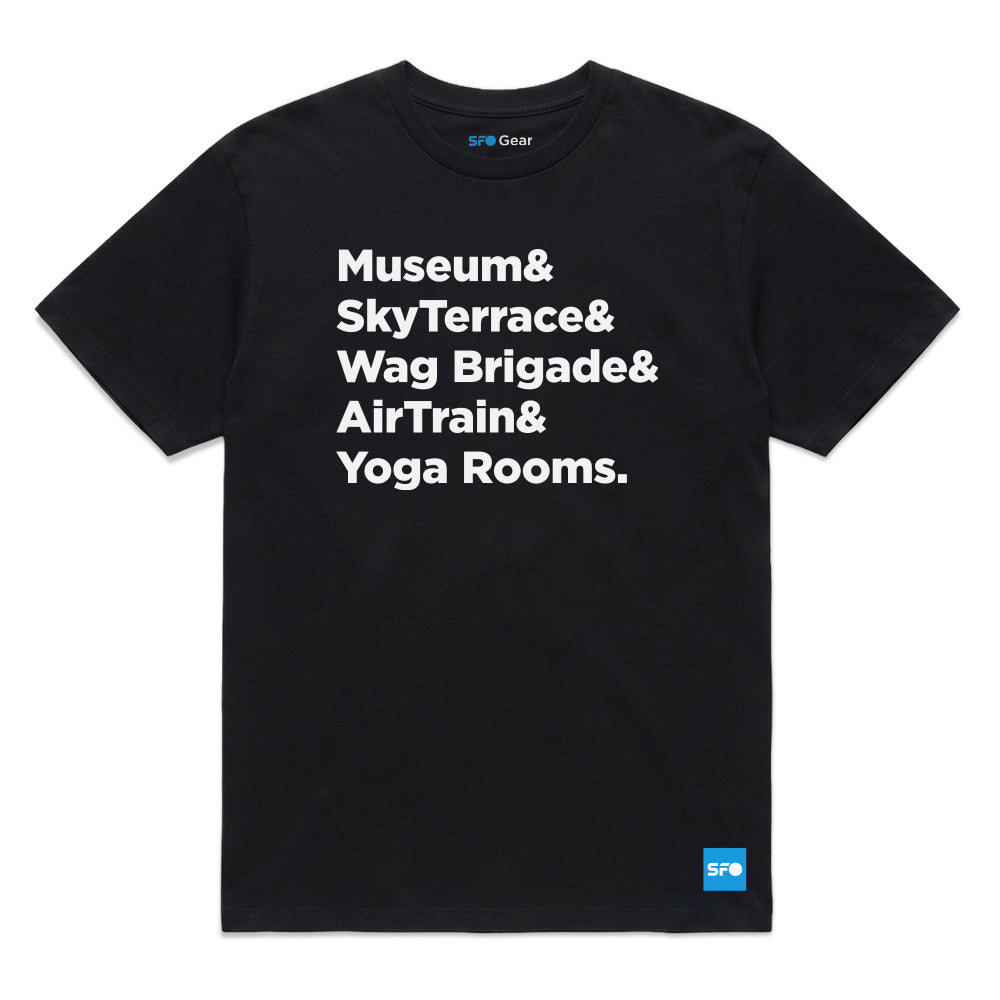 A black short-sleeve crewneck t-shirt with bold white text on the front reading 'Museum& SkyTerrace& Wag Brigade& AirTrain& Yoga Rooms.' A small blue SFO Gear logo is visible inside the collar and on the bottom right hem.