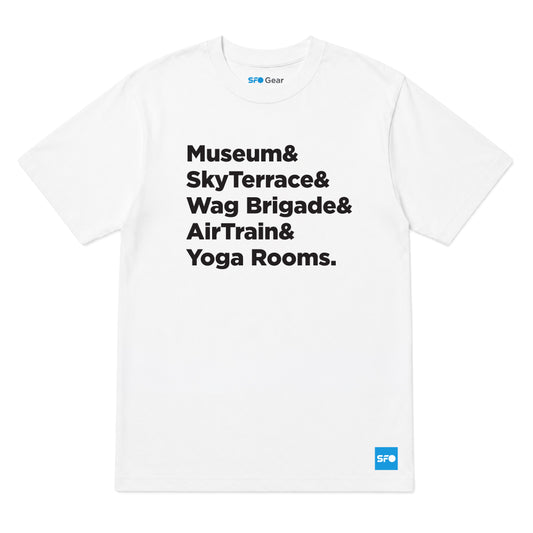 A white short-sleeve crewneck t-shirt with black printed text listing 'Museum& SkyTerrace& Wag Brigade& AirTrain& Yoga Rooms.' on the front, featuring a small blue 'SFO Gear' logo on the bottom right hem and inside the collar.